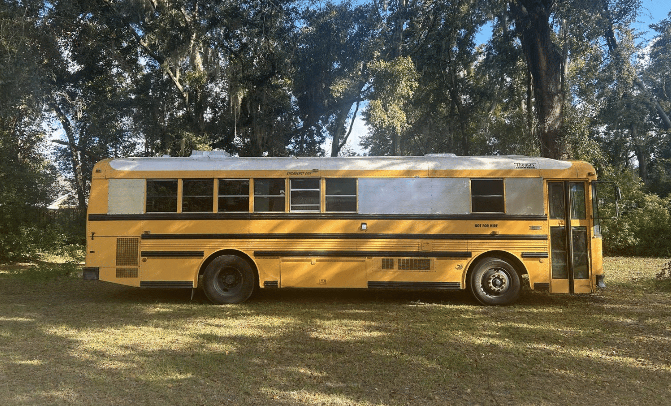 Is this a raised roof bus or are you very short?