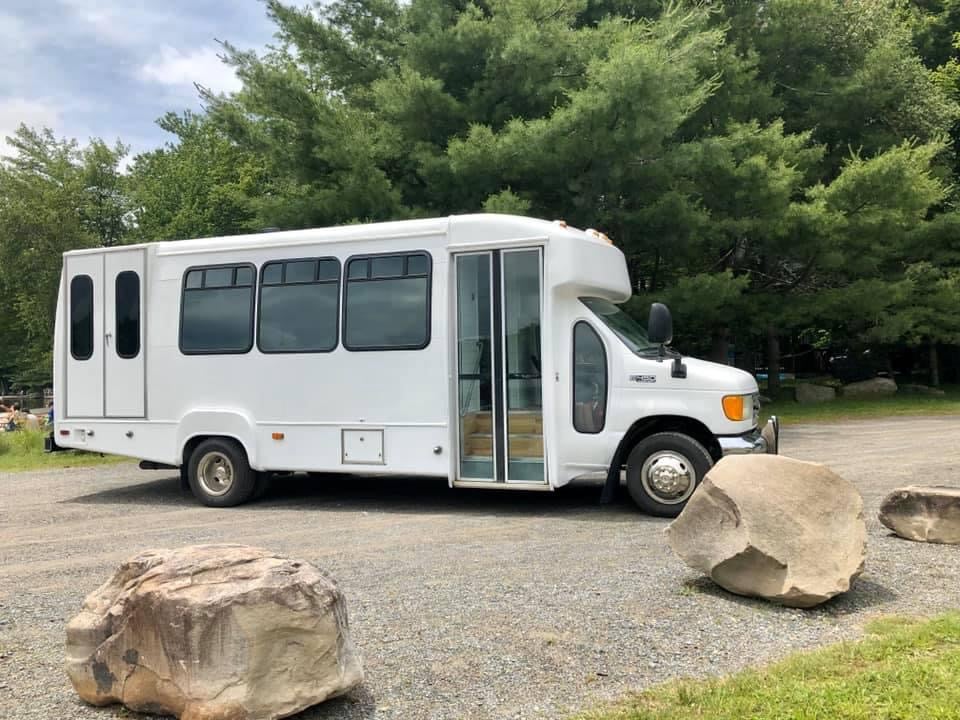 When you travel, does one of you drive a car behind the bus?