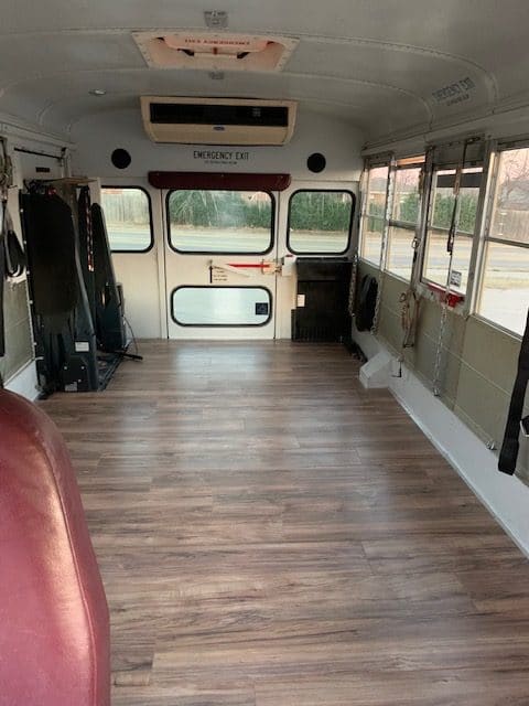 What is the weight of the bus after construction -- staying under GVWR