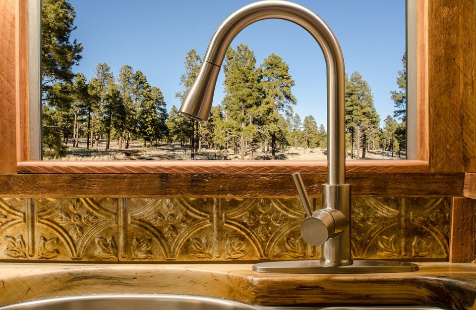 Love the floor plan but with showers and washer etc. what size tank do you have and hows water press