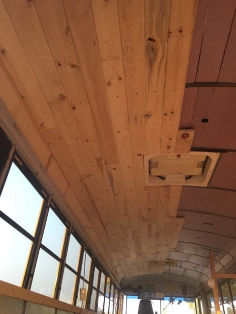 Would sheetrock really stay on the ceiling on a moving bus? Also the weight of the sheetrock.